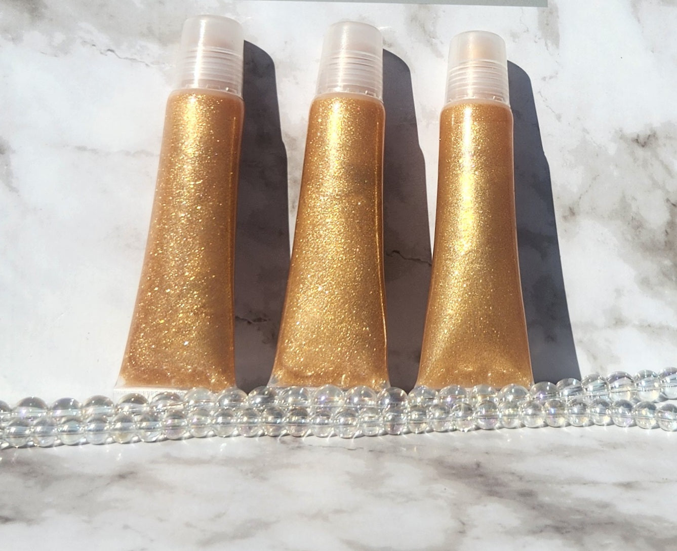 Godly (Gold) shimmering lip gloss