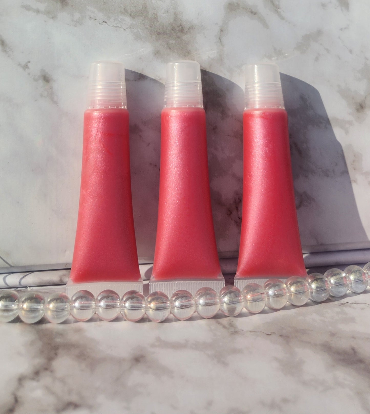 Flight lip gloss ( pretty pink lip gloss)