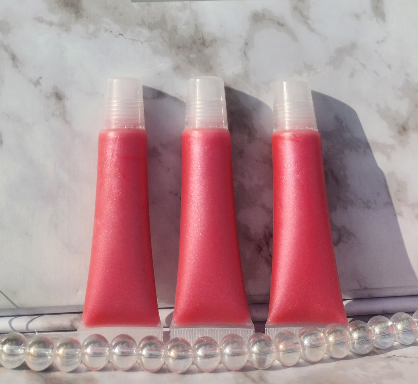 Flight lip gloss ( pretty pink lip gloss)