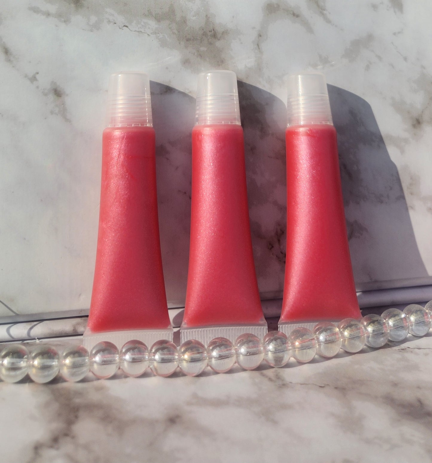 Flight lip gloss ( pretty pink lip gloss)