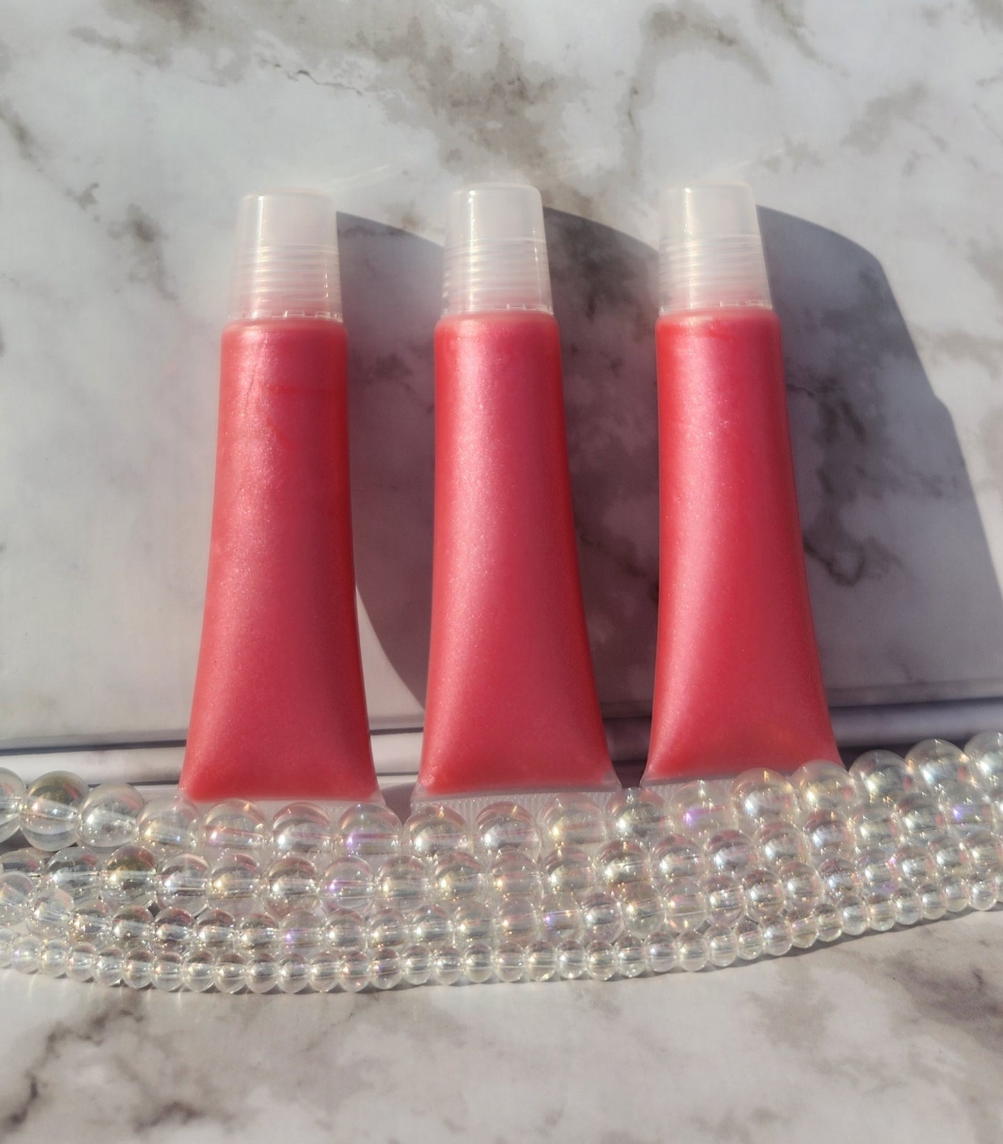 Flight lip gloss ( pretty pink lip gloss)