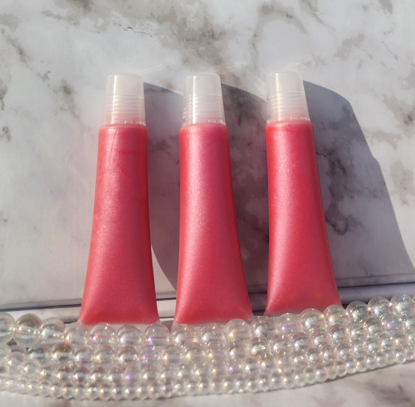 Flight lip gloss ( pretty pink lip gloss)