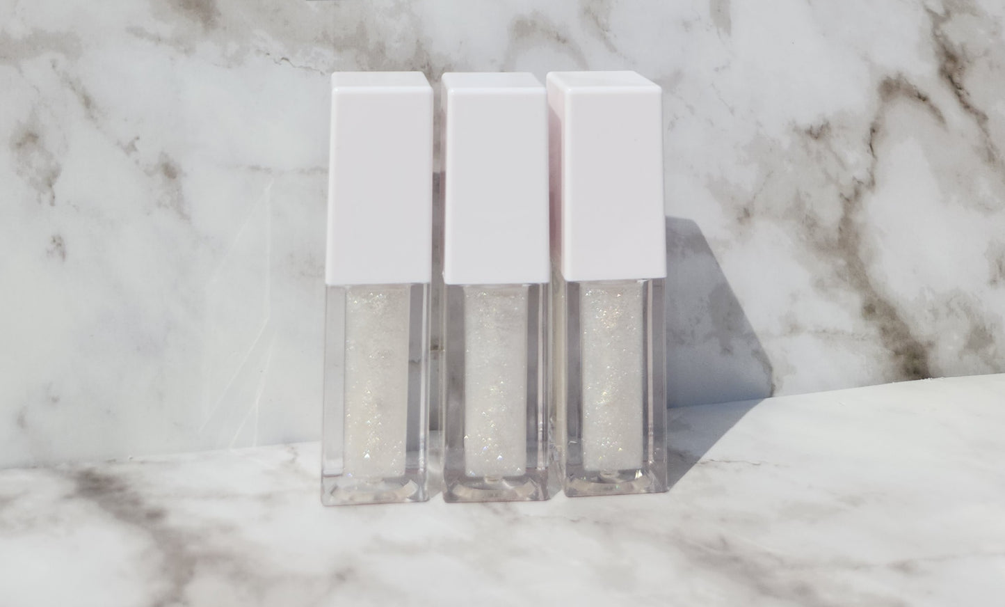 Elohim (sheer shimmering pearl lip gloss) White tube