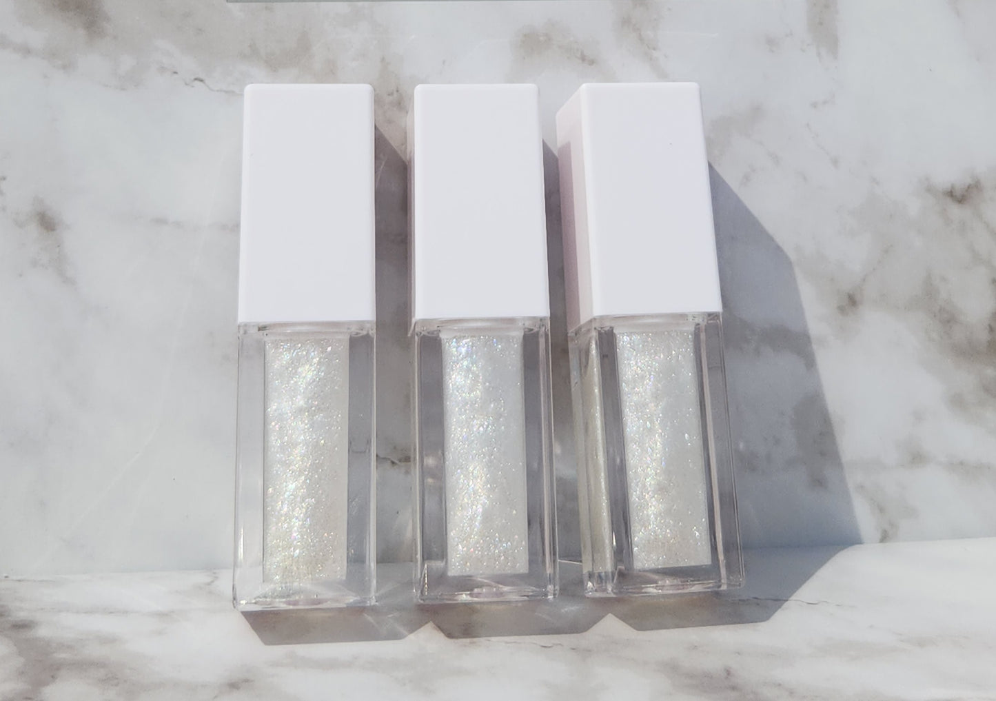 Elohim (sheer shimmering pearl lip gloss) White tube