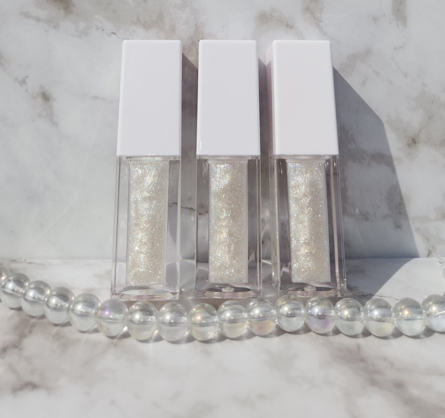 Elohim (sheer shimmering pearl lip gloss) White tube