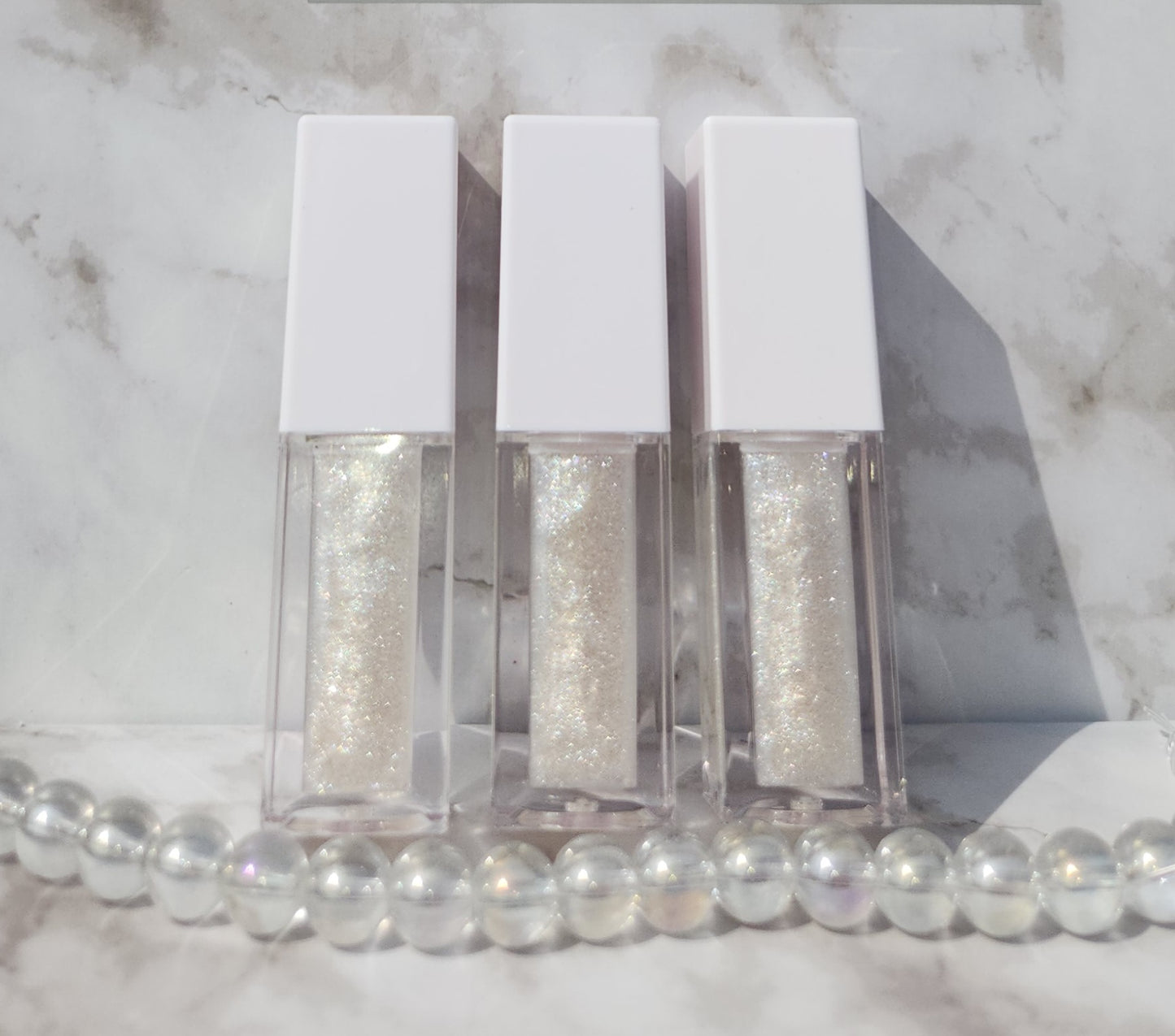 Elohim (sheer shimmering pearl lip gloss) White tube