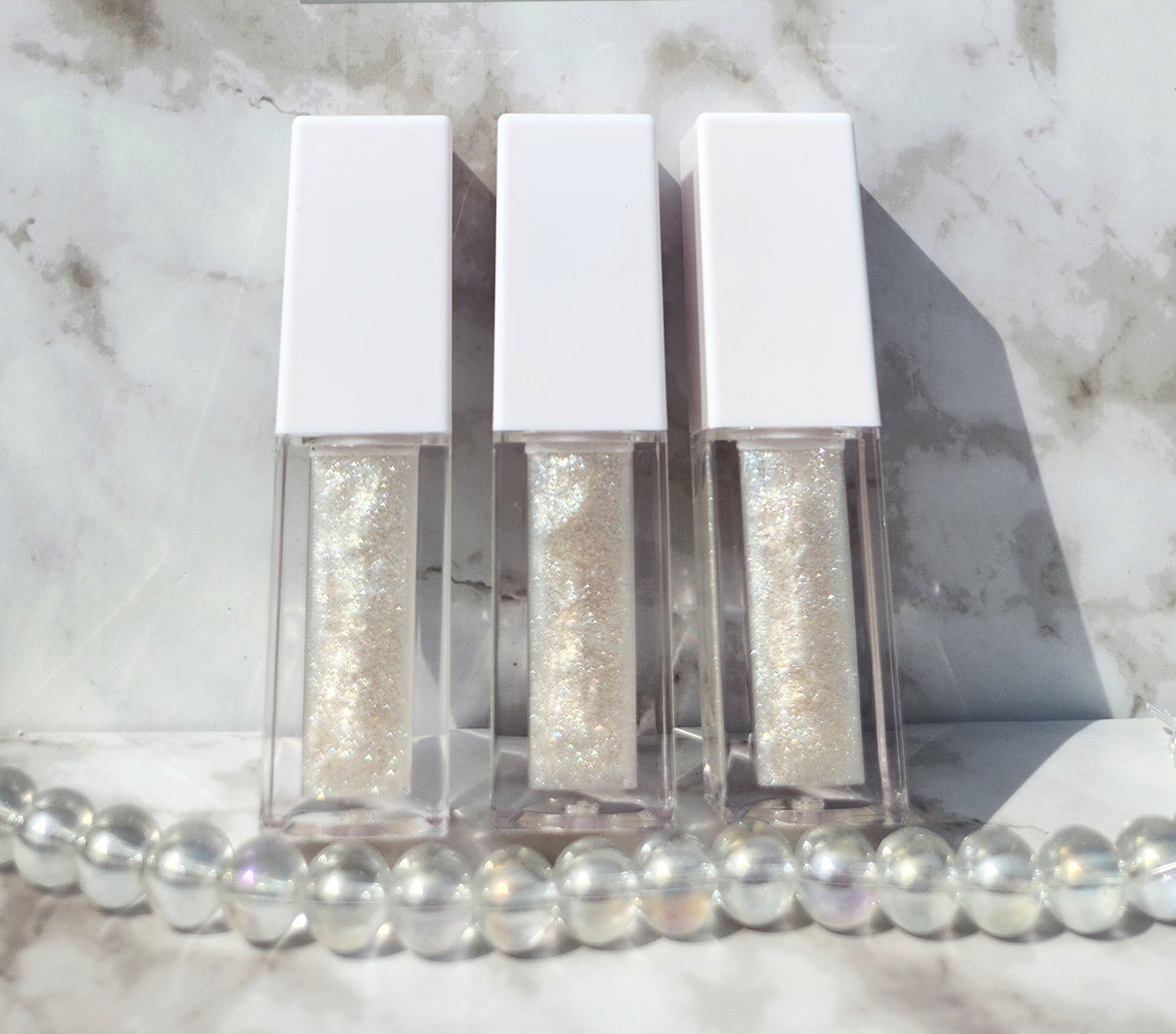 Elohim (sheer shimmering pearl lip gloss) White tube