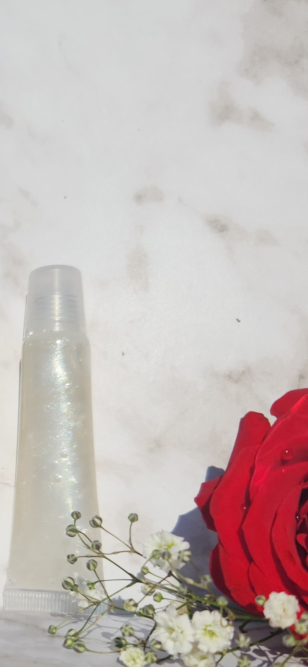 Elohim (sheer shimmering pearl lip gloss)