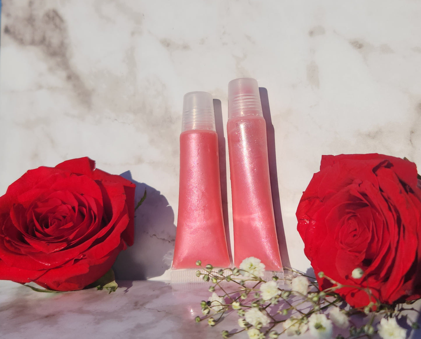 Flight lip gloss ( pretty pink lip gloss)