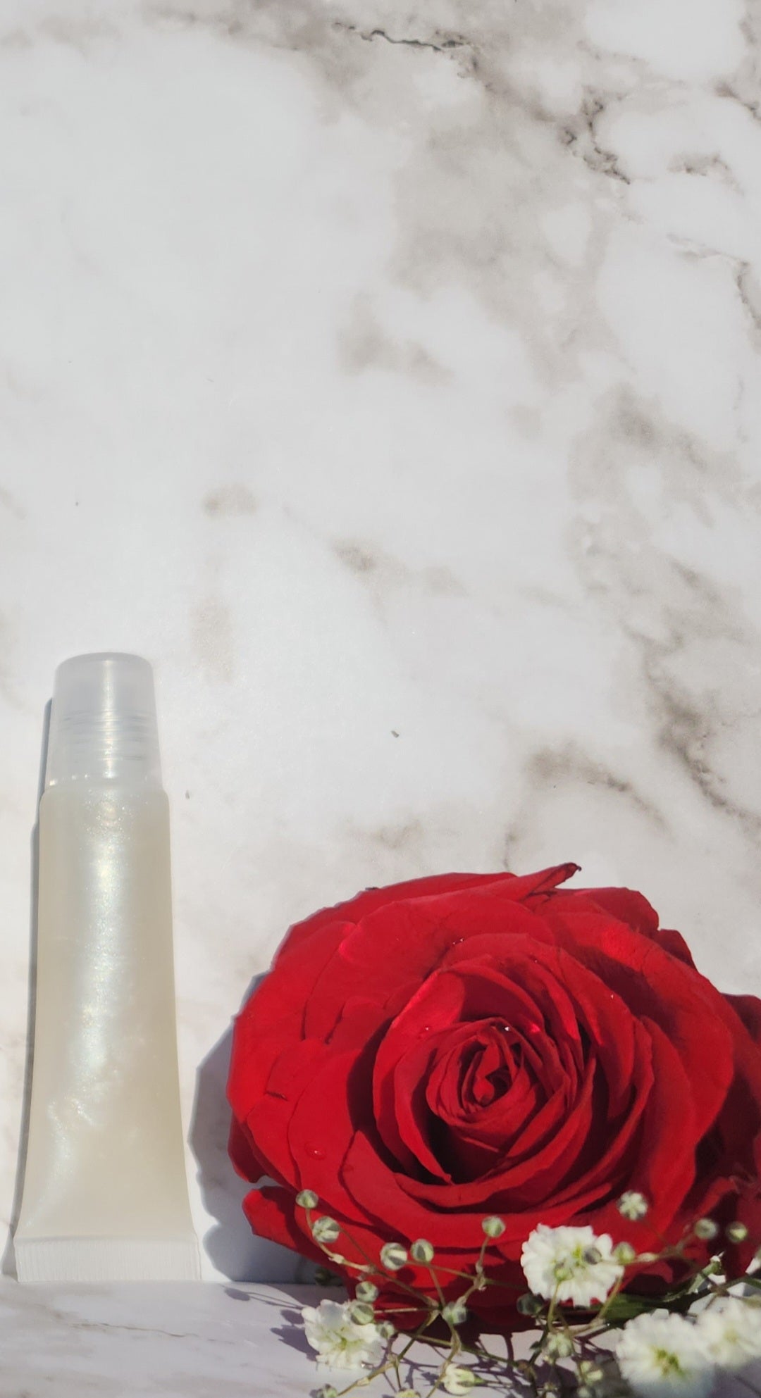 Elohim (sheer shimmering pearl lip gloss)