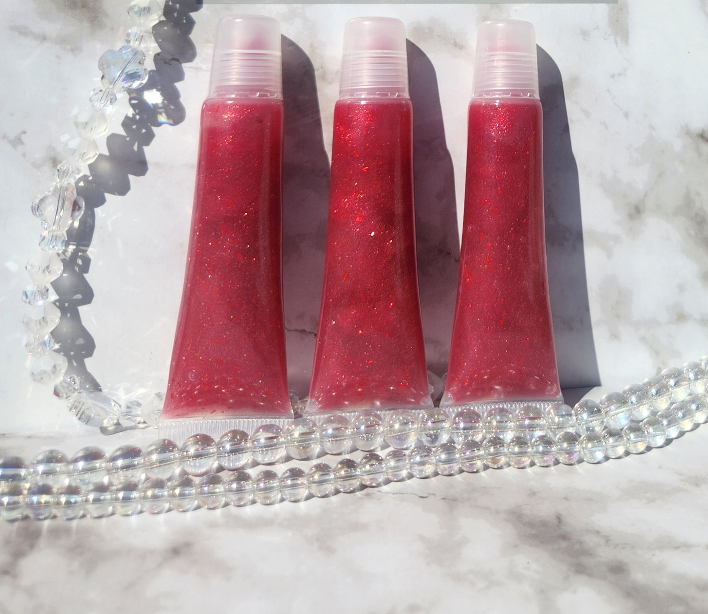 Covered (Red glitter lip gloss)