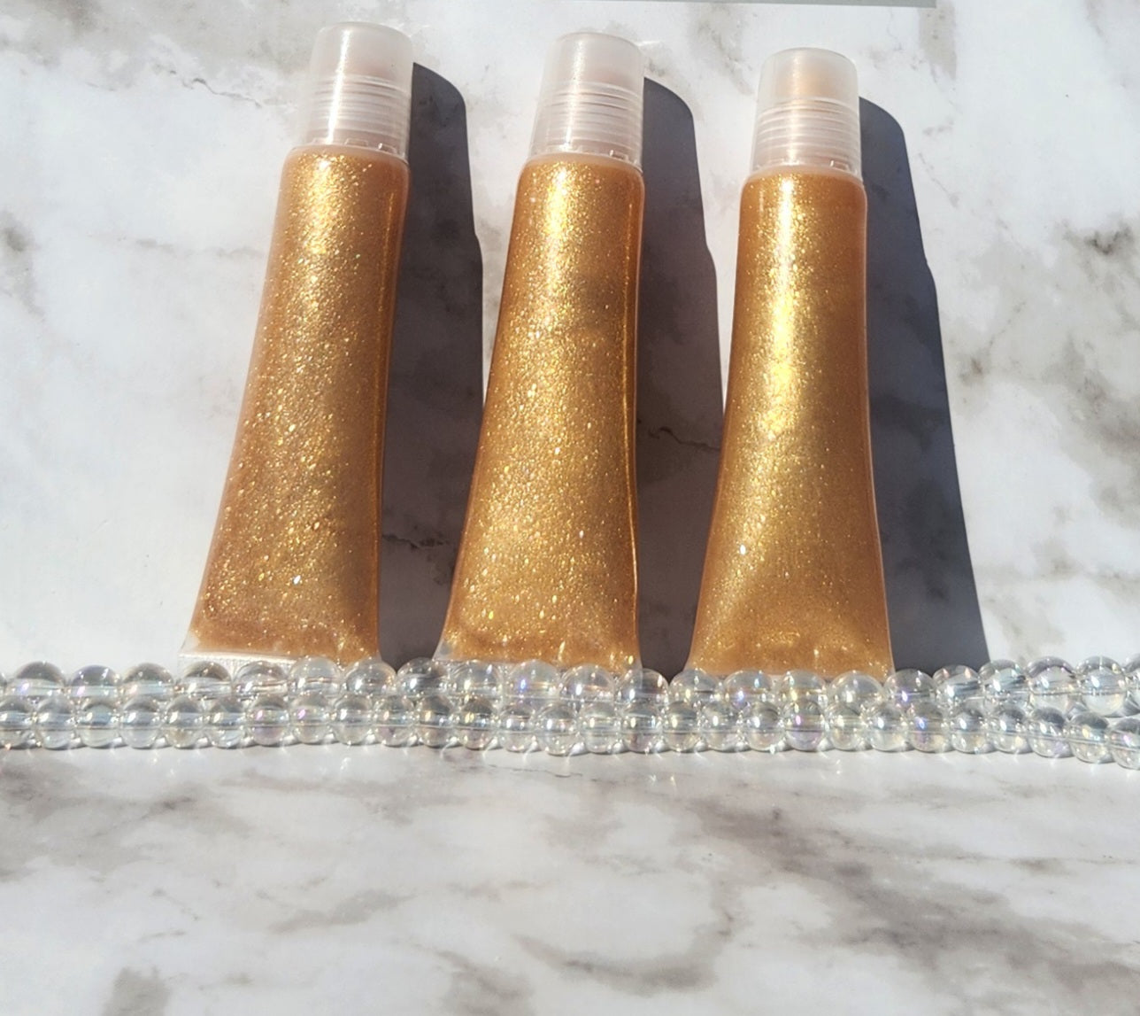 Godly (Gold) shimmering lip gloss