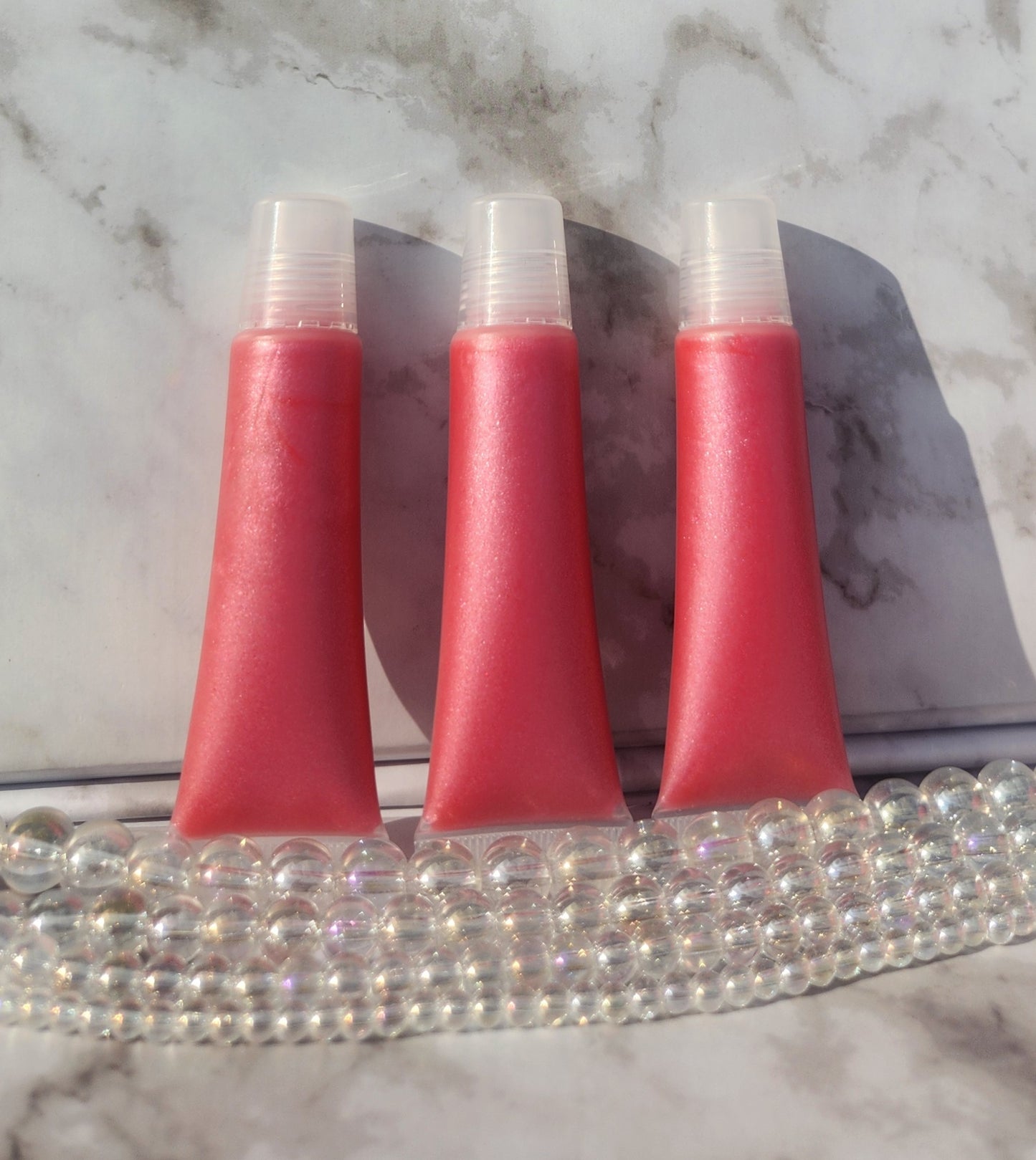 Flight lip gloss ( pretty pink lip gloss)