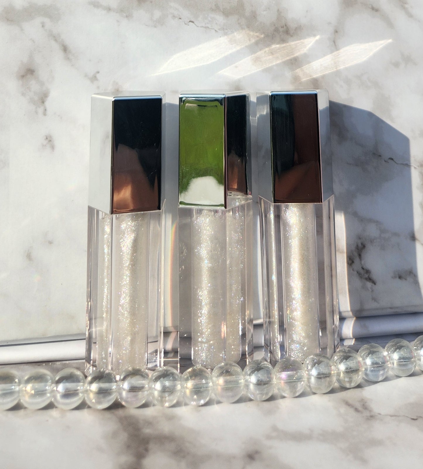 Elohim (sheer shimmering pearl lip gloss) Silver tube