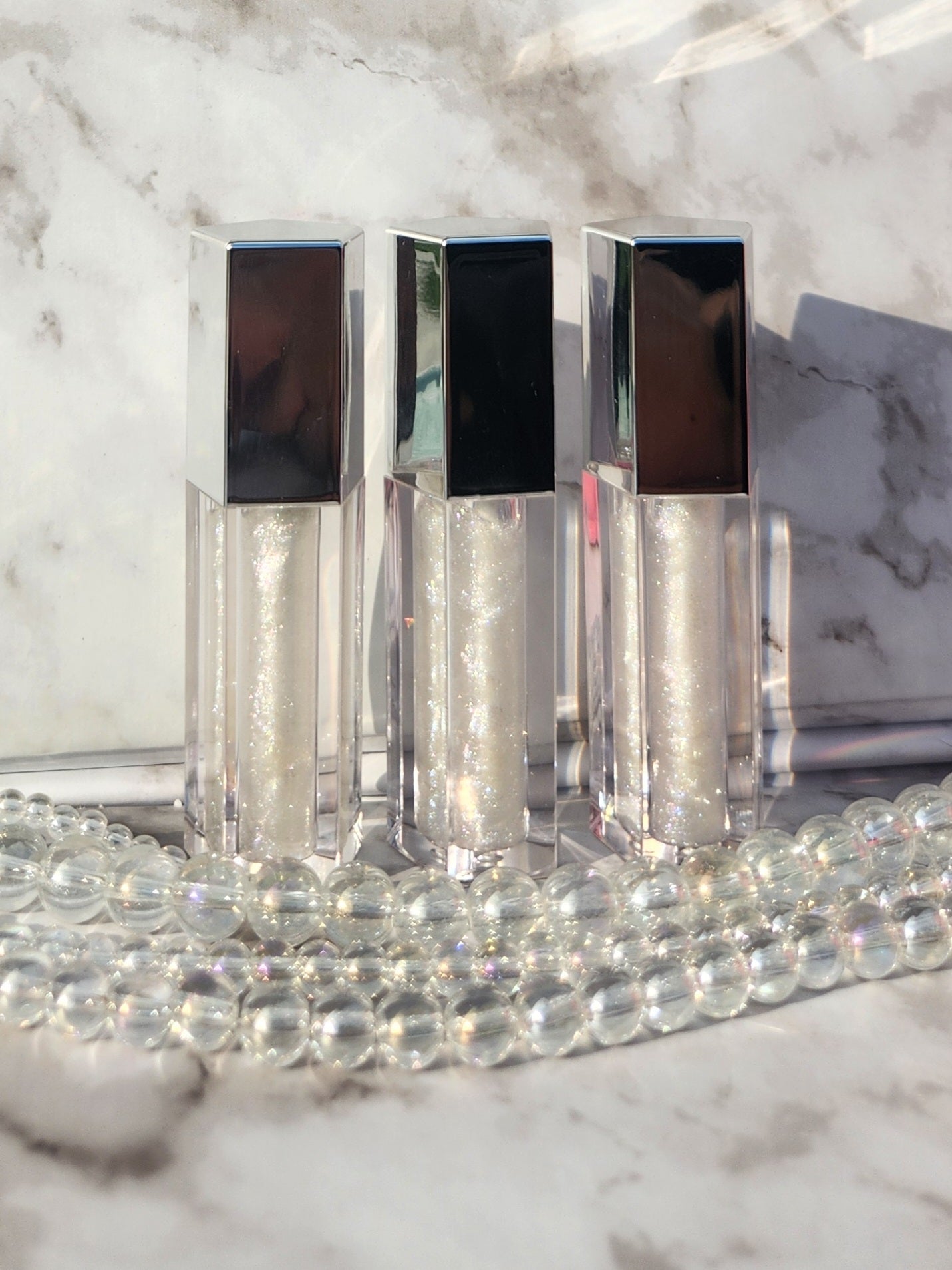 Elohim (sheer shimmering pearl lip gloss) Silver tube