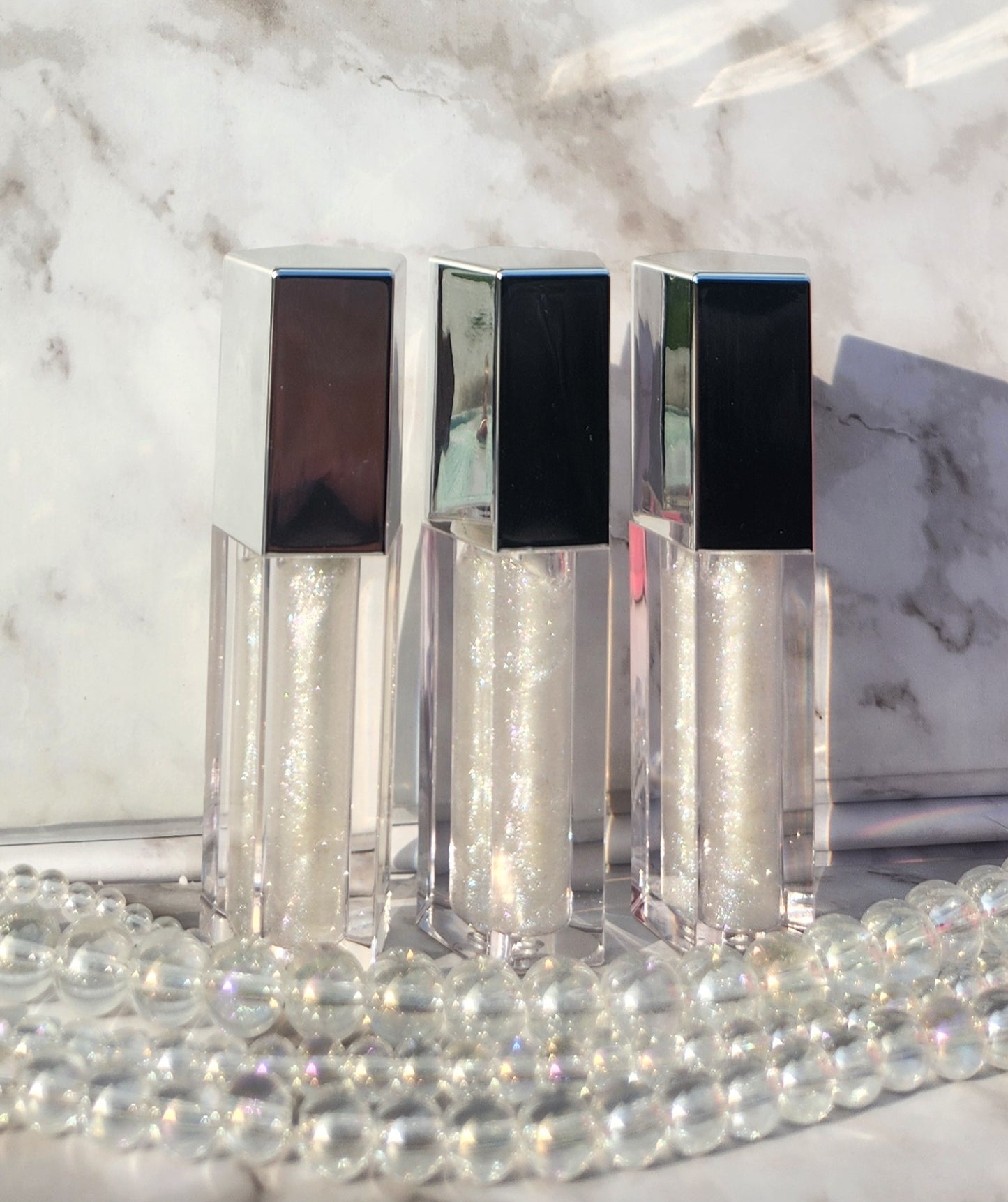 Elohim (sheer shimmering pearl lip gloss) Silver tube