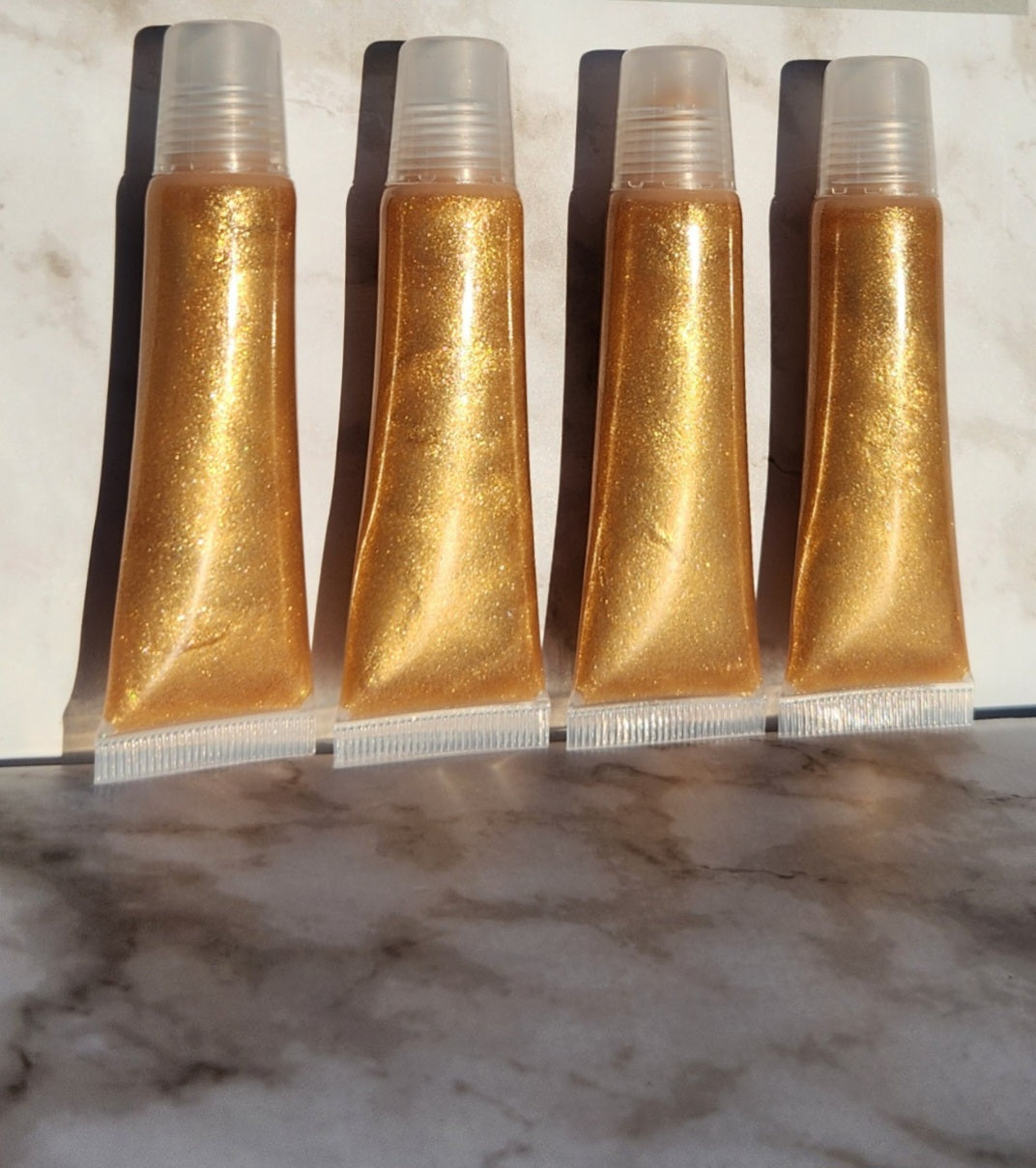 Godly (Gold) shimmering lip gloss